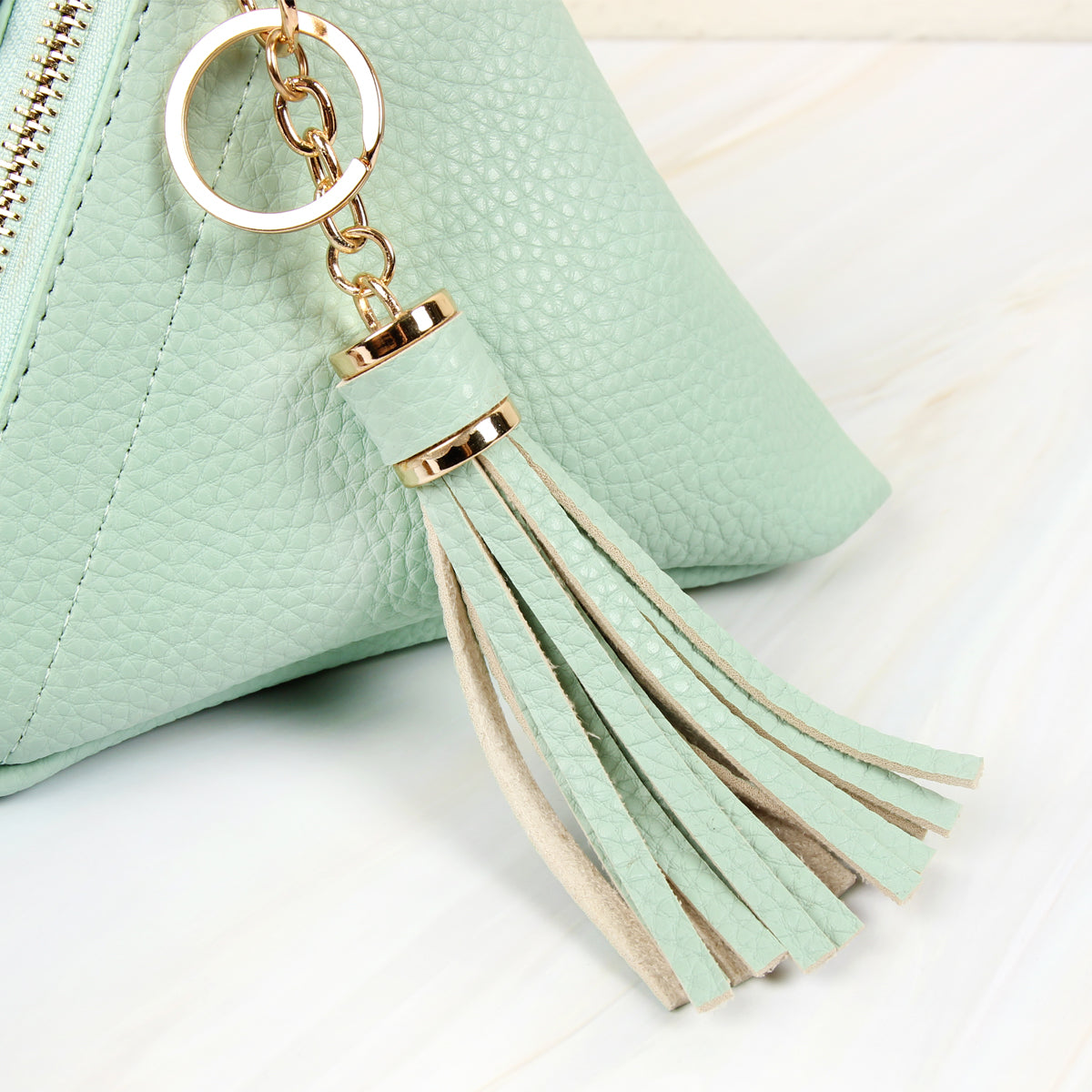 Pyramid Shape Tassel Wristlet Leather Bag